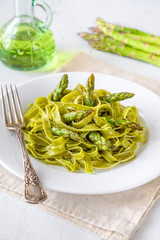 Spinach fettuccine with fried asparagus