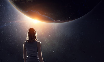 Girl looking at Earth planet