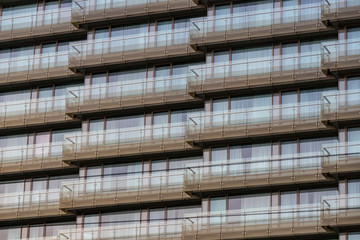 The background of the window of a multi-storey building is shot closeup. 