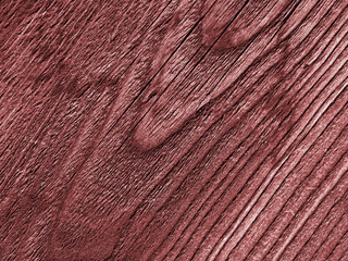 Red wooden background with detailed wood structure with knots and nail holes. Dark wood texture...