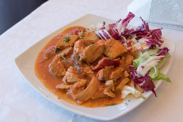 Stew with tomato sauce and onion