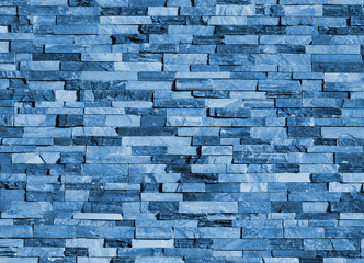 Old blue brick wall texture background, stone block wall texture, rough and grunge surface as used for backdrop, wallpaper and graphic web design. Interior home new pattern designed structure