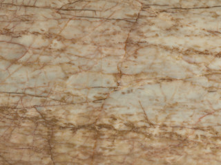 Marble background with brown texture. Stone kitchen countertop with natural pattern. Ceramic tile for interior and exterior decoration. Brown marble backdrop