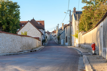 Quiet and peaceful streat in a small French village at sunset