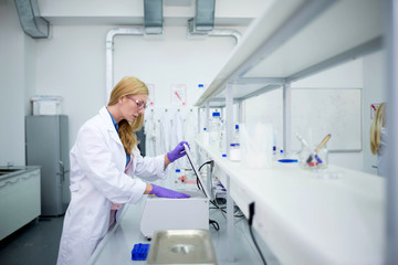 Laboratory scientist researching chemical compositions