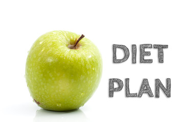 Diet Plan words written on isolated background with fresh green apple