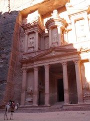 front view on The ancient Treasury, el-Khazneh, Petra, Jordan during sunrise with camel