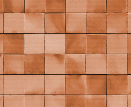 Old bronze brick wall texture background orange stone block wall texture, rough and grunge surface as used for backdrop, wallpaper and graphic web design. Interior home new pattern designed structure 