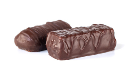 Whole dark brown delicious chocolate isolated on white background.