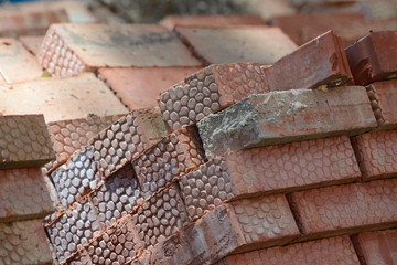 Bricks in a pile fresh out of the owen