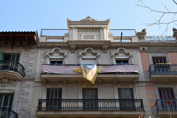 Naklejka premium Facade of Spanish Apartment Building with Wrought Iron Railings on Balconies 