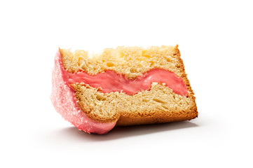 Isolated slice of panettone, an Italian type of sweet bread loaf, with strawberry icing and filling and sugar sprinkles on top, usually prepared and enjoyed for Christmas and New Year