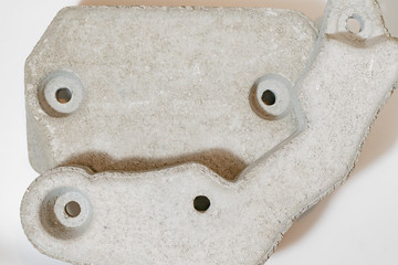 A fragment of the stone counterweight on a washing machine