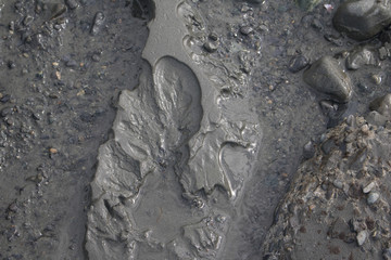 Closeup details of eroded sandy beach - texture background