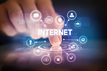 Finger touching tablet with web technology icons and INTERNET inscription, web technology concept