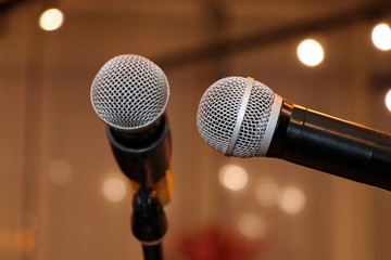 Naklejka na ściany i meble Microphone. Microphone on stage. Wireless sound equipment.Selective focus