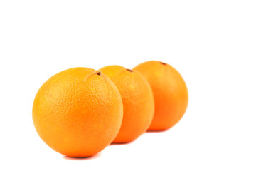 Three ripe oranges isolated on white background.