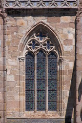 Pointed ogive arch with gothic window at Tréguier cathedral in Brittany, France