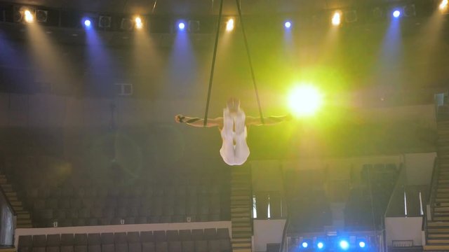 Aerialist on canvases in circus