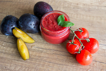 Fresh tkemali sauce from plums,pepper and other vegetables in studio