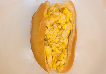 Bread with scrambled egg. Brazilian snack knows as 