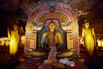 Sitting Buddha, statue in Dambulla cave temple. UNESCO Golden Temple of Dambulla, beautiful sacred place in Sri Lanka. Very popular tourist place.