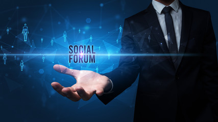 Elegant hand holding SOCIAL FORUM inscription, social networking concept
