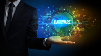 Elegant hand holding HARDWARE inscription, digital technology concept