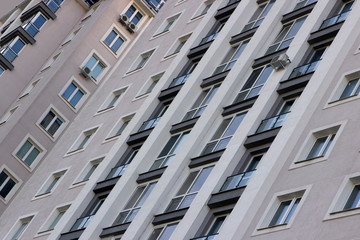 Real estate, new, modern, building with balconies, close-up, fragment.