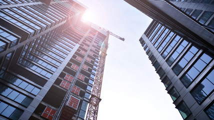 Building under construction at sunset.