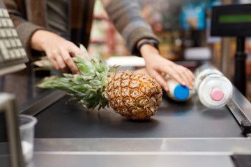 Young adult woman bring food checkout desk