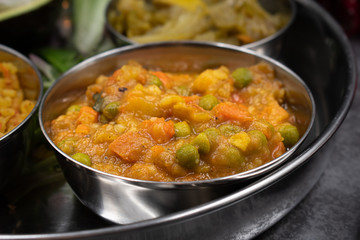 Indian mixed vegetable curry in tiny serving bowl