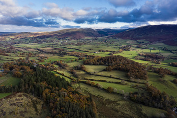 Fototapeta na wymiar Beautiful aerial drone colorful Autumn Fall landscape image of view from Low Fell in Lake District