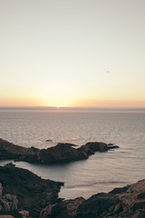 sea bay with rocks at sunrise