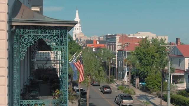 Aerial: Charleston house, veranda & church on Broad St. South Carolina, USA. 8 August 2019