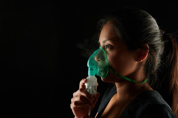 Hispanic woman with medicine mask