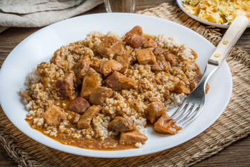 Barley groats with stewed meat.