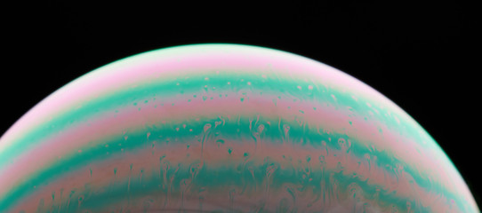 Colorful lines on liquid sphere