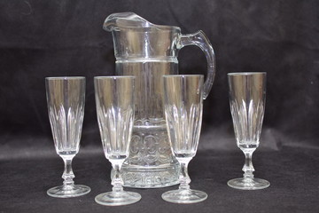 Mock up  design set of elegant and traditional drink ware / drinking glass & Jar for wine or juice, transparent isolated on black background template for branding identity and company logo