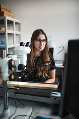 Young beautiful woman work in students laboratory. Student working in lab.  - 314565204