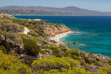 Fototapeta na wymiar Scenic view at beach Akra Fourni nearby Monolithos at Rhodes island with green vegetation in the foreground and the aegean sea in the background