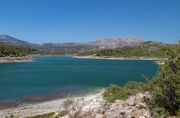Obraz premium Scenic view dammed lake Limni Apolakkias at Greek island Rhodes