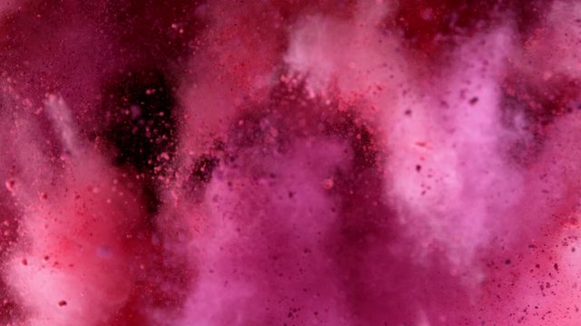 Super slow motion of coloured powder explosion isolated on black background. Filmed on high speed cinema camera, 1000 fps.