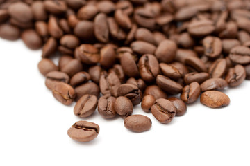Close up shot of coffee beans on white background