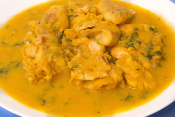 Braised Fish Fillet or Stew fish. Cooked fish made with tomatoes, onions, peppers and coriander.