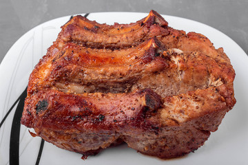 Roast pork loin on a white plate