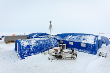 Arctic background. Base polar explorers. Camping tents of expedition to the North pole. Development Of The Arctic. Special equipment for life support in extreme polar conditions.