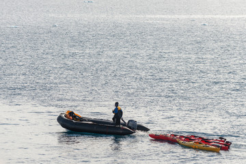 Inflatable boat with one person in Antarctica © Alexey Seafarer