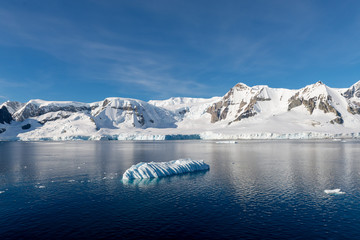 Antarctic landscape with iceberg at sea © Alexey Seafarer