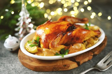 Delicious Roasted Chicken with Apple Slices. Christmas background.